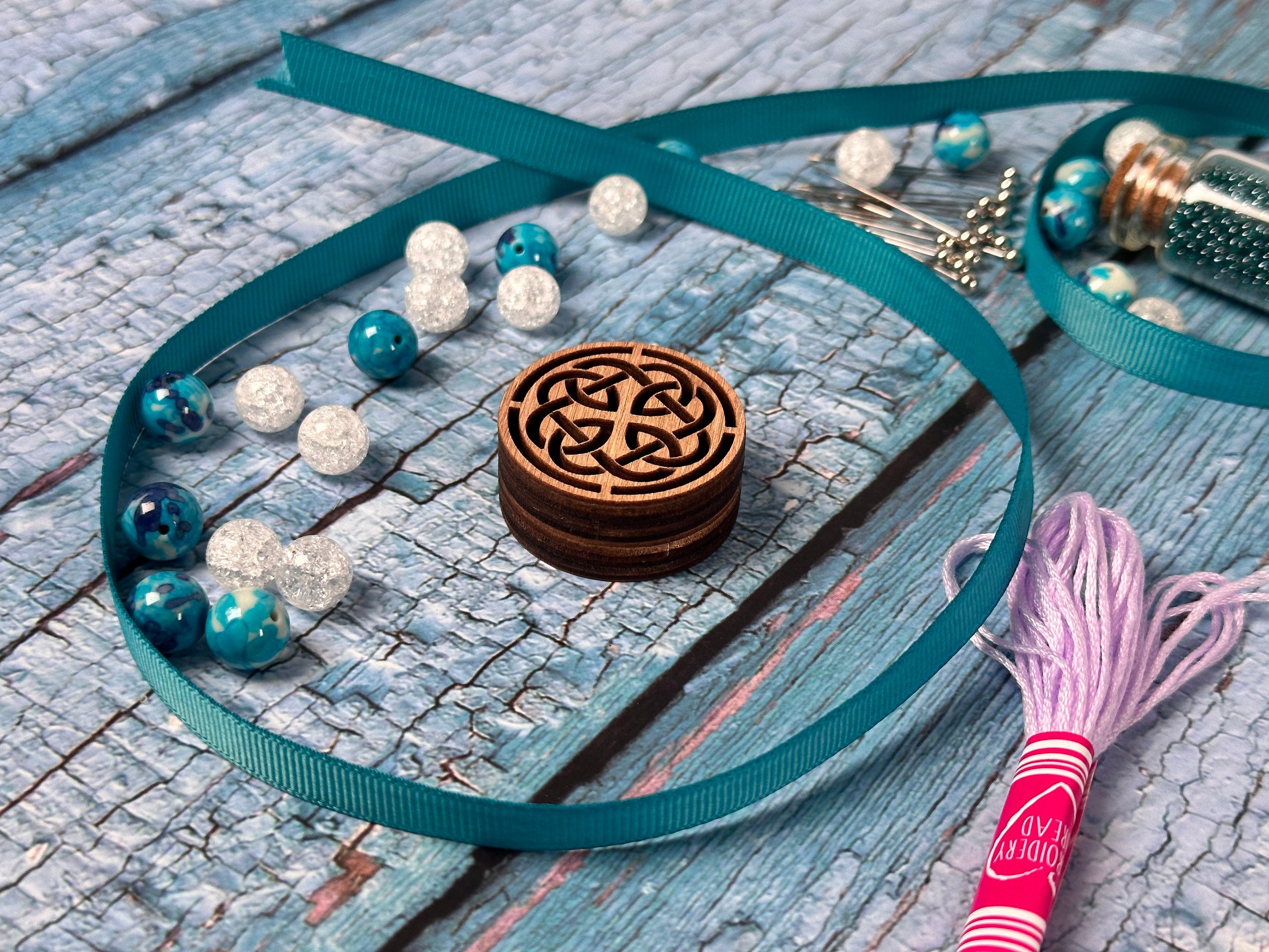 a necklace with a wooden box on it